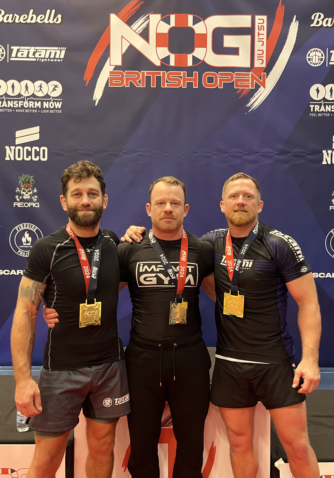 Tom and clients all taking a British BJJ title
